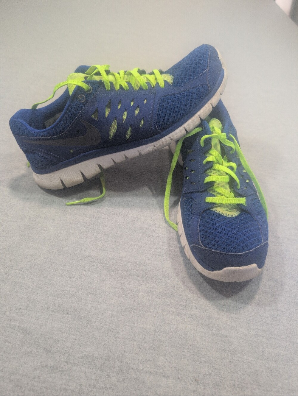 Nike blue running shoes size 9  with neon green laces